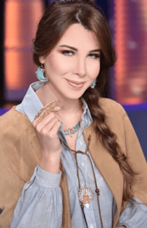 استوحي تسريحات شعركِ في ليلة رأس السنة من نانسي عجرم